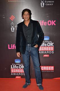 Chunky Pandey poses for the media at 21st Annual Life OK Screen Awards Red Carpet