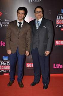 Girish Kumar and Ramesh Taurani pose for the media at 21st Annual Life OK Screen Awards Red Carpet