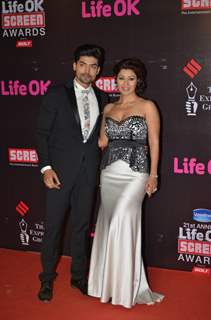 Gurmeet and Debina Choudhary pose for the media at 21st Annual Life OK Screen Awards Red Carpet