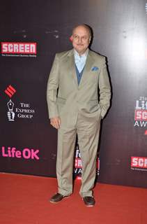 Anupam Kher poses for the media at 21st Annual Life OK Screen Awards Red Carpet