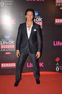 Tiger Shroff poses for the media at 21st Annual Life OK Screen Awards Red Carpet