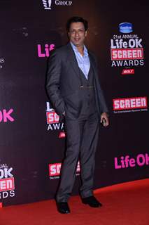 Madhur Bhandarkar poses for the media at 21st Annual Life OK Screen Awards Red Carpet