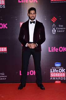 Sidharth Malhotra poses for the media at 21st Annual Life OK Screen Awards Red Carpet