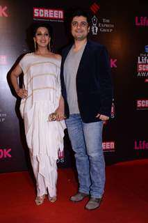 Goldie Behl and Sonali Bendre pose for the media at 21st Annual Life OK Screen Awards Red Carpet