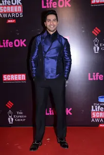 Varun Dhawan poses for the media at 21st Annual Life OK Screen Awards Red Carpet