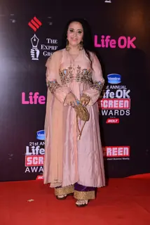Ila Arun poses for the media at 21st Annual Life OK Screen Awards Red Carpet