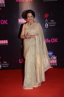 Tanuja poses for the media at 21st Annual Life OK Screen Awards Red Carpet