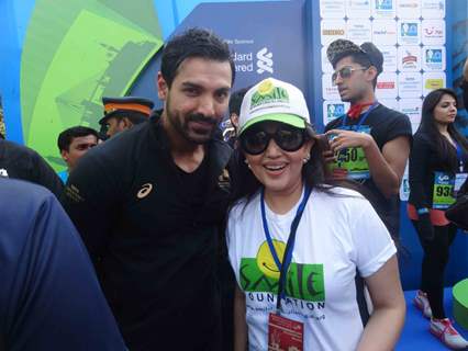 John Abraham and Archana Kochhar pose for the media at Standard Chartered Mumbai Marathon 2015