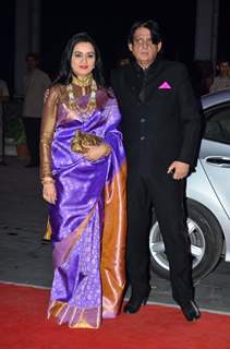 Padmini Kolhapure poses with husband at Kush Sinha's Wedding Reception