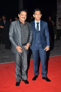 Udit Narayan and Aditya Narayan pose for the media at Kush Sinha's Wedding Reception