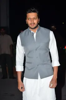 Riteish Deshmukh poses for the media at Kush Sinha's Wedding Reception