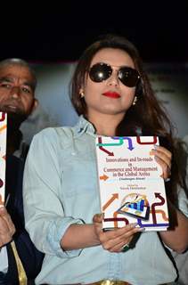 Rani Mukherjee poses with a book at Mumbai University