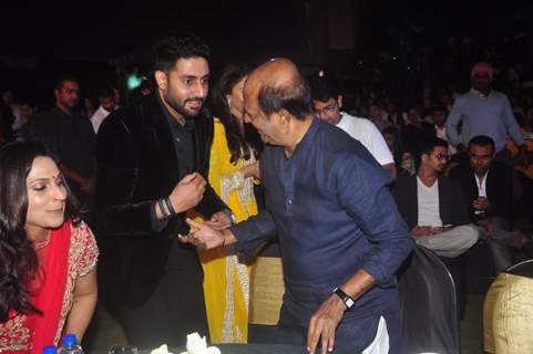 Abhishek Bachchan was snapped greeting Rajinikanth at the Music Launch of Shamitabh