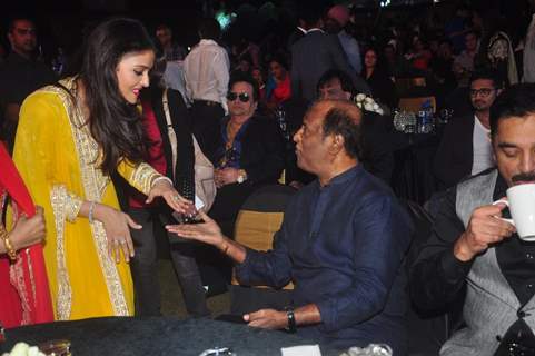 Aishwarya Rai Bachchan was snapped greeting Rajinikanth at the Music Launch of Shamitabh