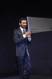 Dhanush interacts with the audience at the Music Launch of Shamitabh