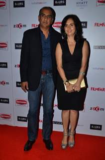 Milan Luthria poses with wife at Filmfare Nominations Bash