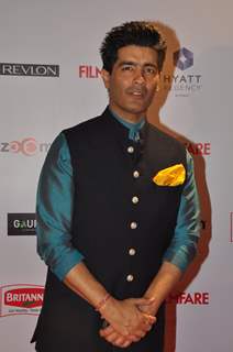 Manish Malhotra poses for the media at Filmfare Nominations Bash