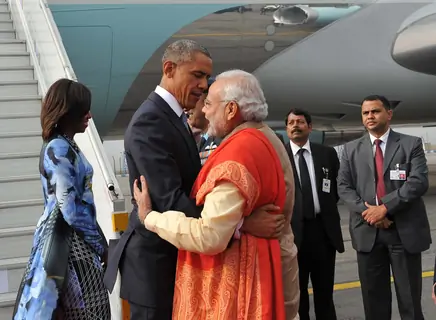 Barack Obama greets Narendra Modi by giving him a hug