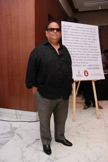 Satish Kaushik poses for the media at Arya Babbar's Book Launch