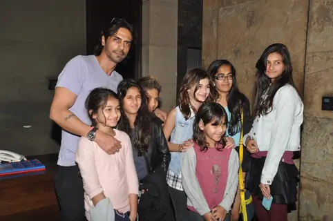 Arjun Rampal poses with children at the Special Screening of Roy