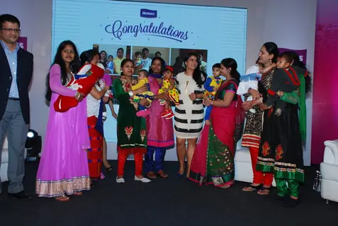 Kajol poses with guests at Huggies Event