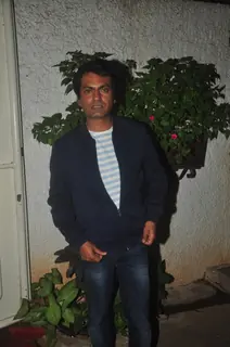 Nawazuddin Siddiqui poses for the media at the Special Screening of Badlapur