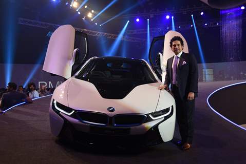 Sachin Tendulkar poses alongside the new BMW i8 at the Launch