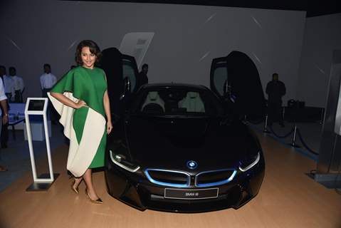 Sonakshi Sinha poses alongside the new BMW i8 at the Launch