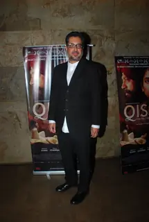 Anup Singh poses for the media at the Special Screening of Qissa