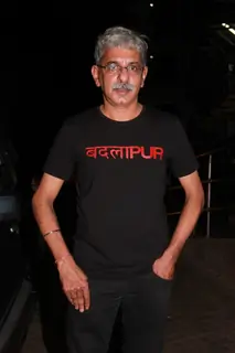 Sriram Raghavan poses for the media at the Special Screening of Badlapur