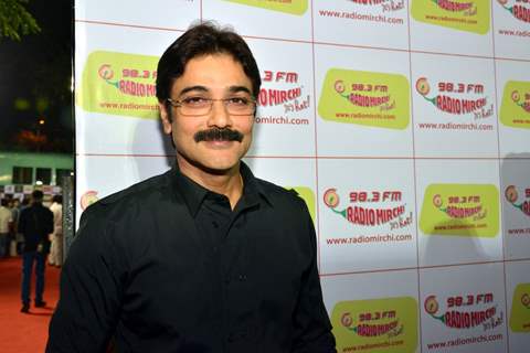 Prosenjit Chatterjee poses for the media at Royal Stag Mirchi Music Awards Bangla 2014