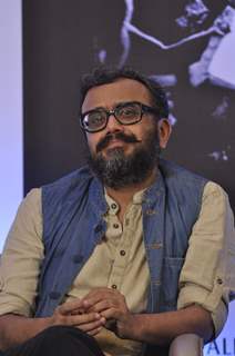 Dibakar Banerjee smiles for the camera at Dinesh Raheja and Jeetendra Kothari's Book Launch