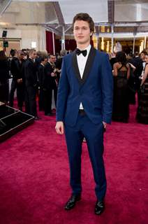 Ansel Elgort poses for the media at the Oscars Red Carpet 2015