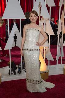 Julianne Moore poses for the media at the Oscars Red Carpet 2015