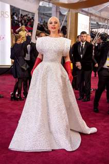 Lady Gaga poses for the media at the Oscars Red Carpet 2015