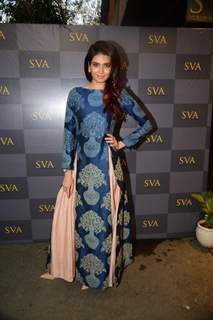 Karishma Tanna poses for the media at Sonam and Paras Modi's SVA Store Launch