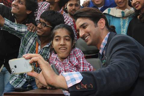 Sushant Singh Rajput clicks a selfie with a special fan at the Fashion Show