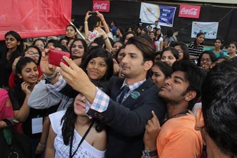Sushant Singh Rajput clicks a selfie with fans at the Fashion Show