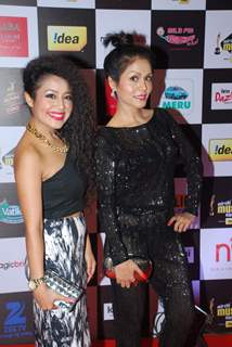 Neha Kakkar poses with a friend at Radio Mirchi Awards