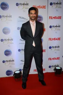 Angad Bedi poses for the media at Filmfare Glamour and Style Awards