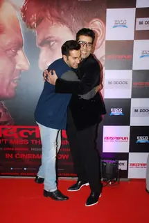 Karan Johar hugs Varun Dhawan at the Success Bash of Badlapur