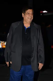 David Dhawan poses for the media at Tulsi Kumar's Wedding Reception