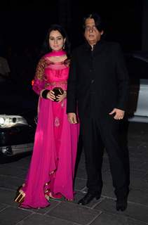 Padmini Kolhapure poses with husband at Tulsi Kumar's Wedding Reception