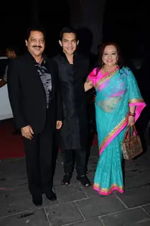 Aditya Narayan poses with his Parents at Tulsi Kumar's Wedding Reception