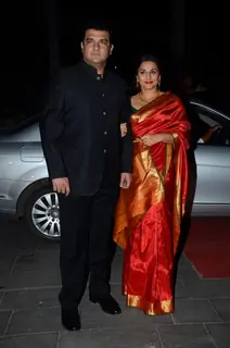 Siddharth Roy Kapoor and Vidya Balan pose for the media at Tulsi Kumar's Wedding Reception