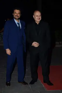 Anil Kapoor and Anupam Kher pose for the media at Tulsi Kumar's Wedding Reception