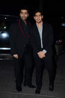 Karan Johar and Ayan Mukerji pose for the media at Tulsi Kumar's Wedding Reception