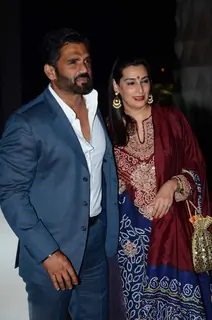 Suniel Shetty and Mana Shetty pose for the media at Tulsi Kumar's Wedding Reception