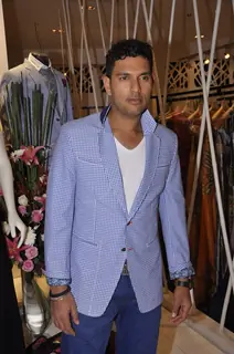 Yuvraj Singh poses for the media at Narendra Kumar's Store Launch