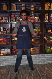 Arjun Kapoor poses for the media at Farah Ki Daawat